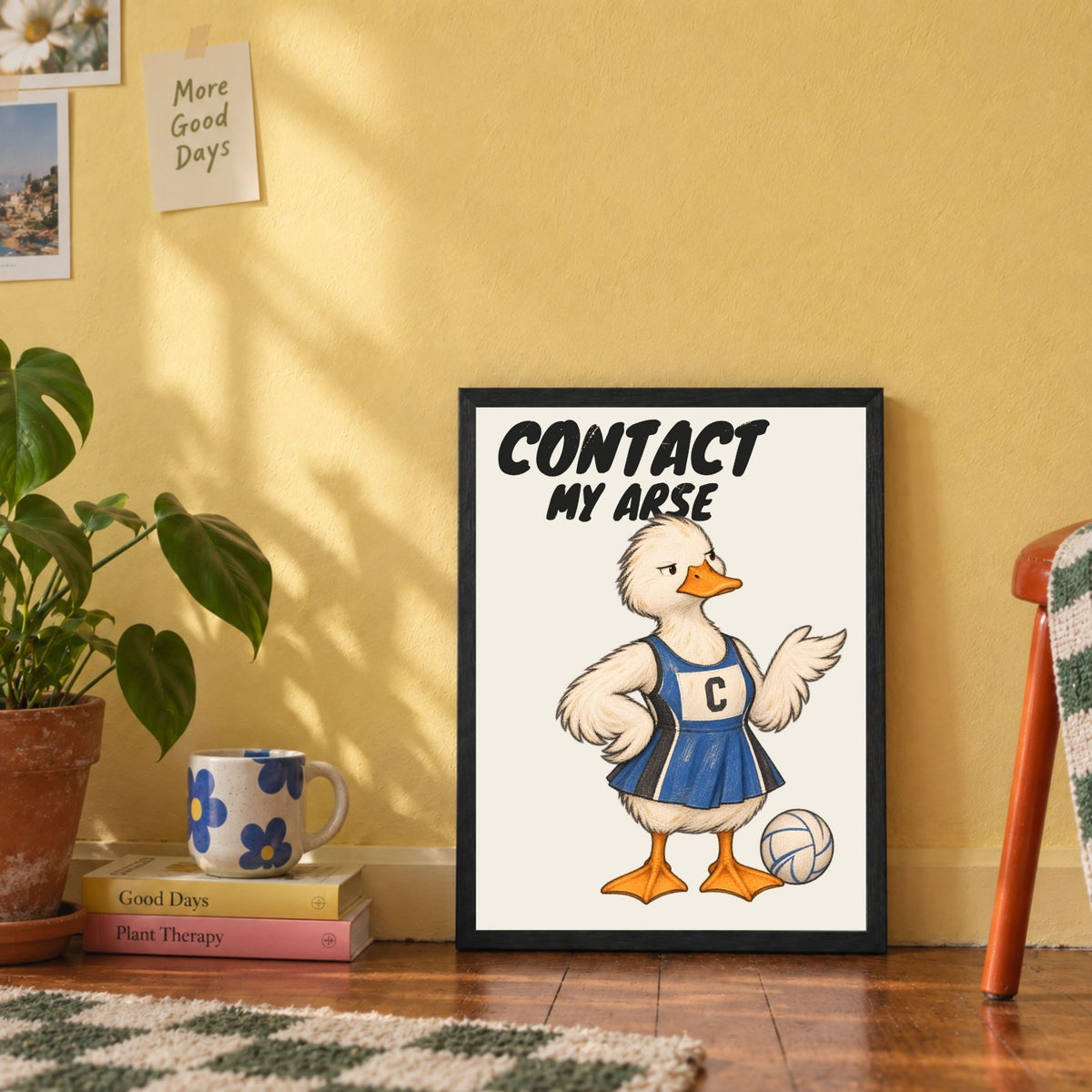 Funny CONTACT MY ARSE netball print displayed in a lifestyle interior