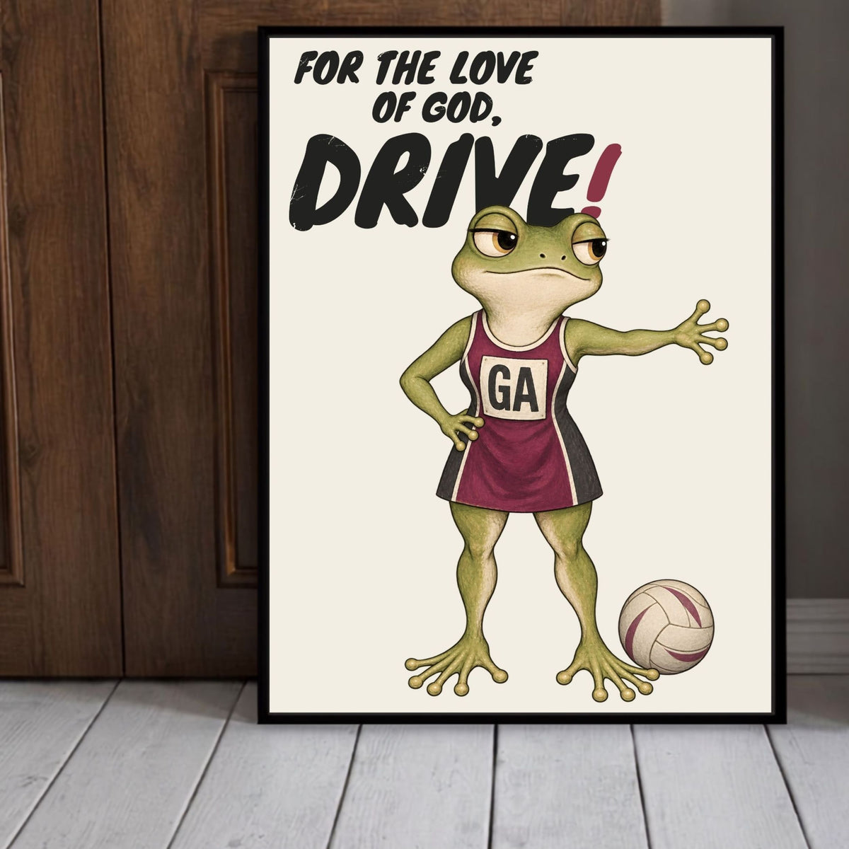 Close-up framed Drive netball print with deadpan frog illustration