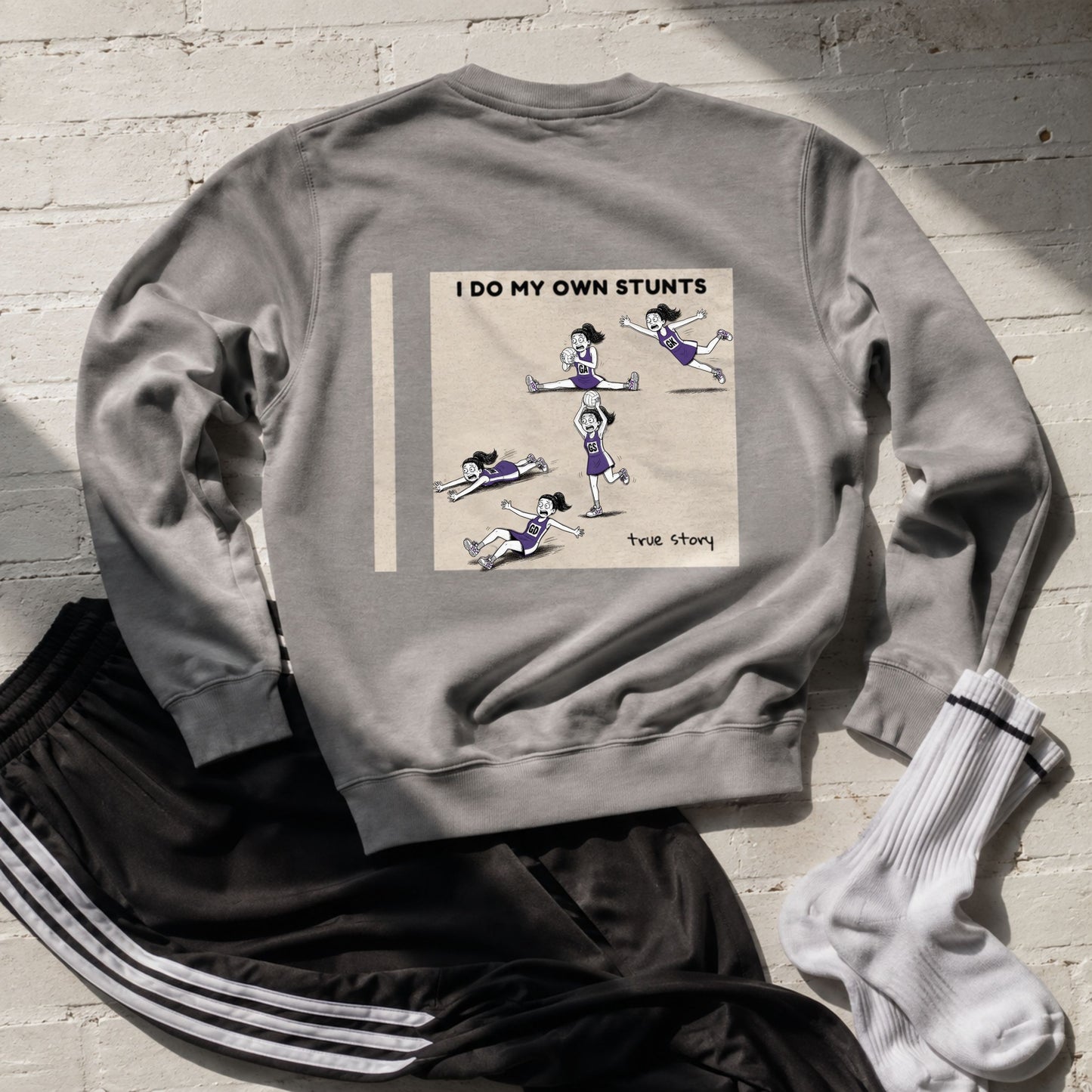 Women's Netball Sweatshirt with I Do My Own Stunts Funny Netball Player Cartoon Print