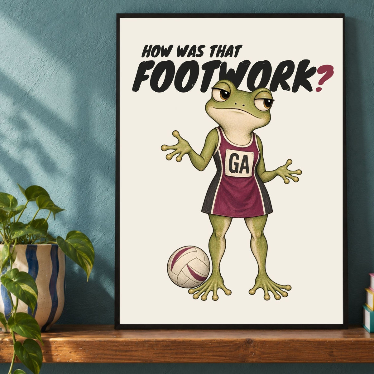 Close-up framed HOW WAS THAT FOOTWORK? netball print with frog illustration