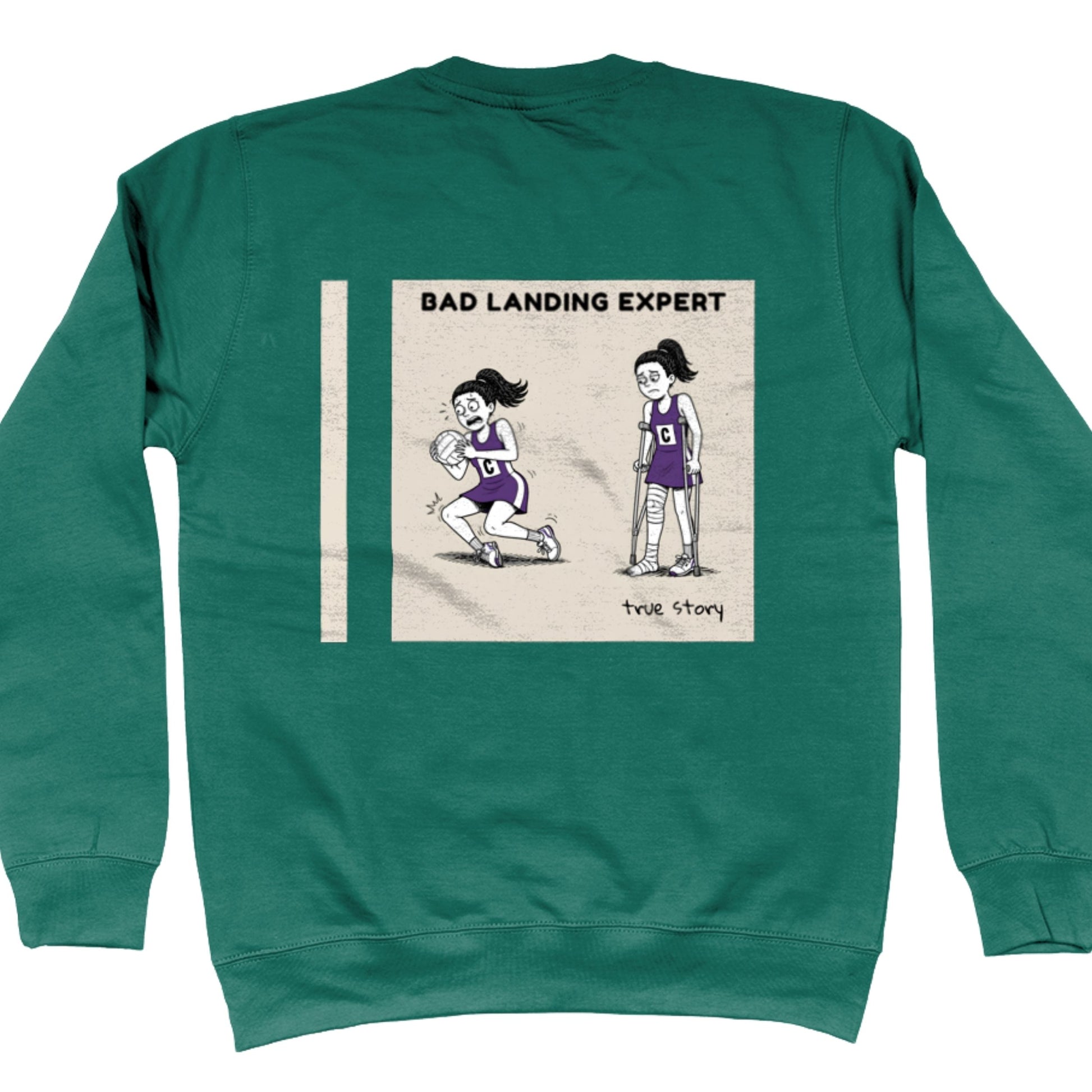 Green Netball Jumper with Funny Bad Landing Expert Cartoon Print