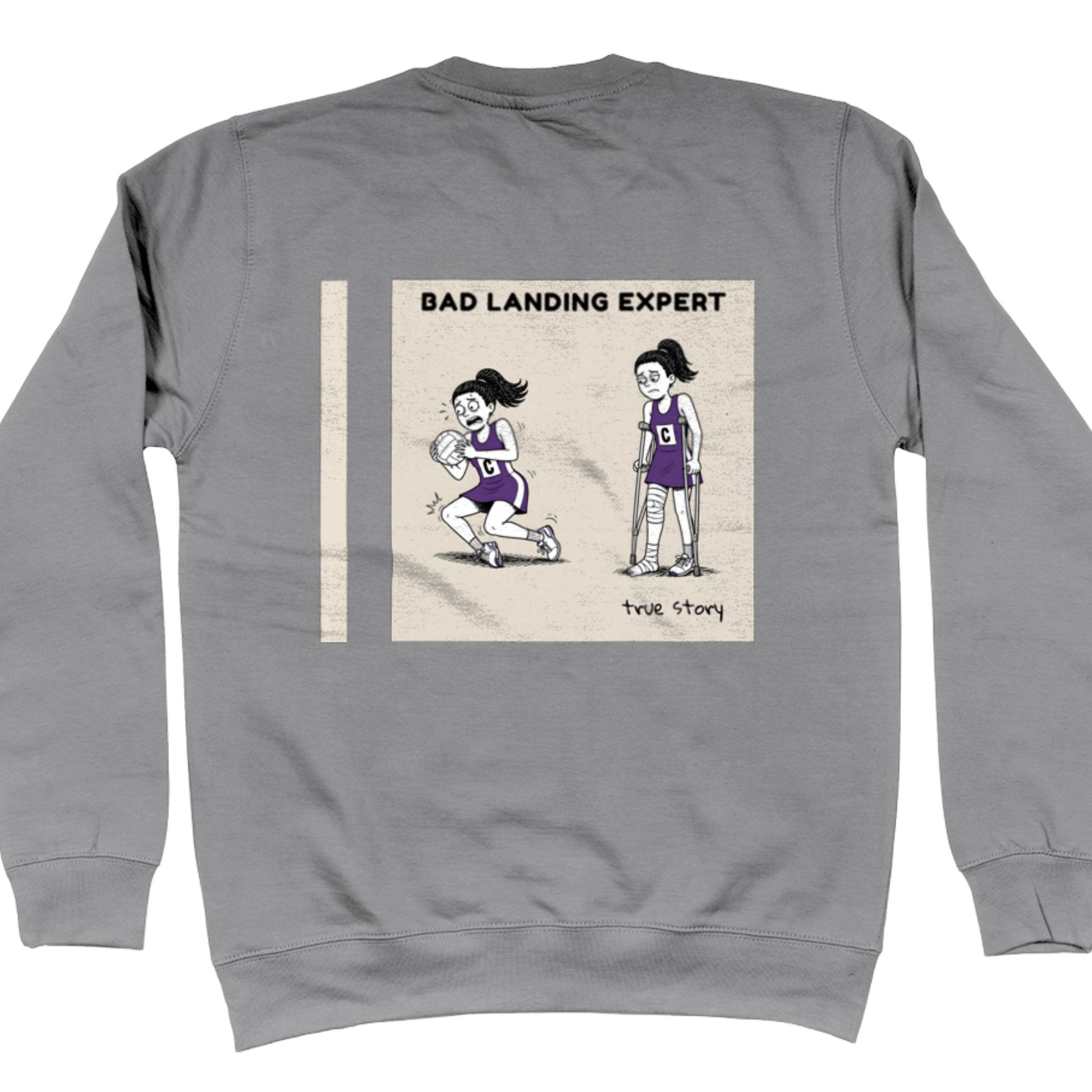 Grey Netball Sweatshirt with Funny Bad Landing Expert Cartoon Print