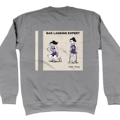 Grey Netball Sweatshirt with Funny Bad Landing Expert Cartoon Print