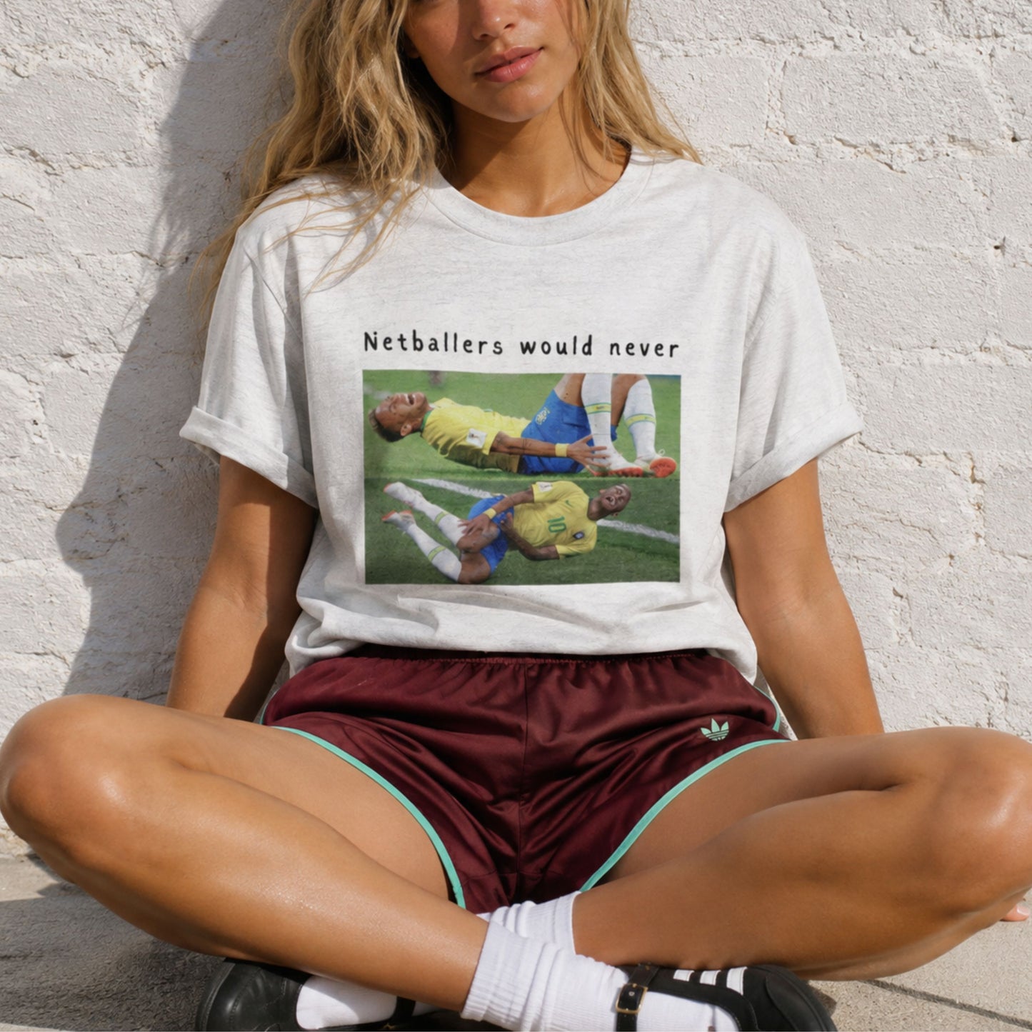 Netball Fashion T-Shirt with Football Graphic - Netballers Would Never Slogan